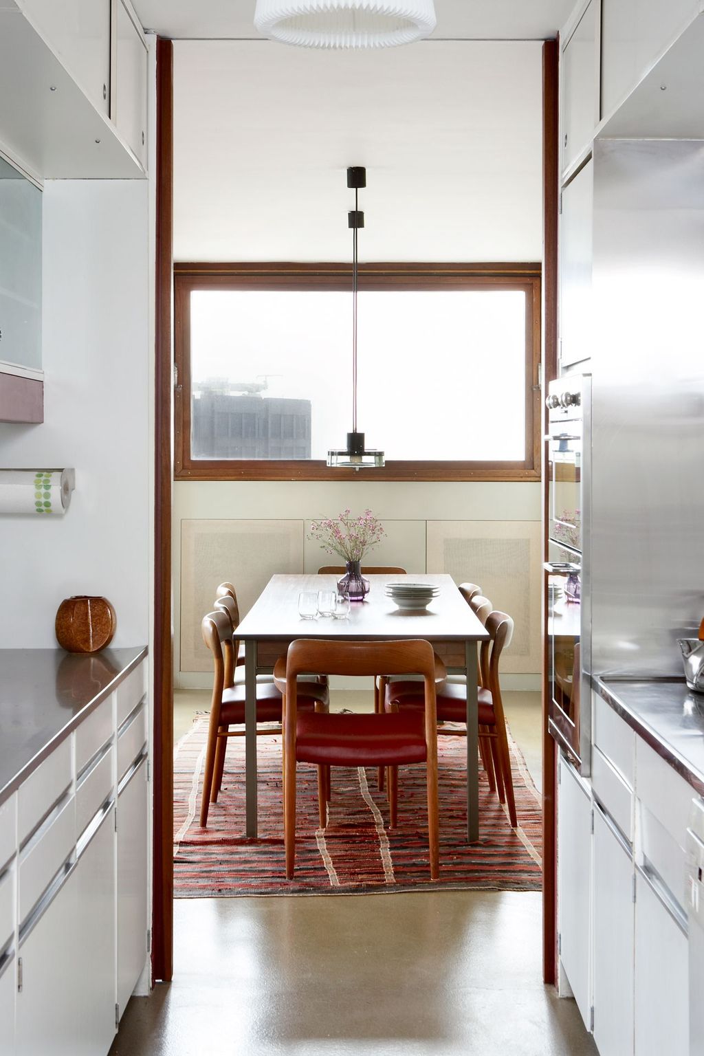 Image may contain Indoors Room Kitchen Furniture Table Dining Table Interior Design Dining Room and Chair