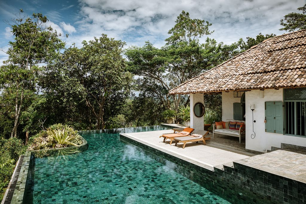 Image may contain Resort Building Hotel Villa House Housing and Water