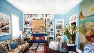 Image may contain Living Room Room Indoors Furniture Couch Human Person Table and Interior Design