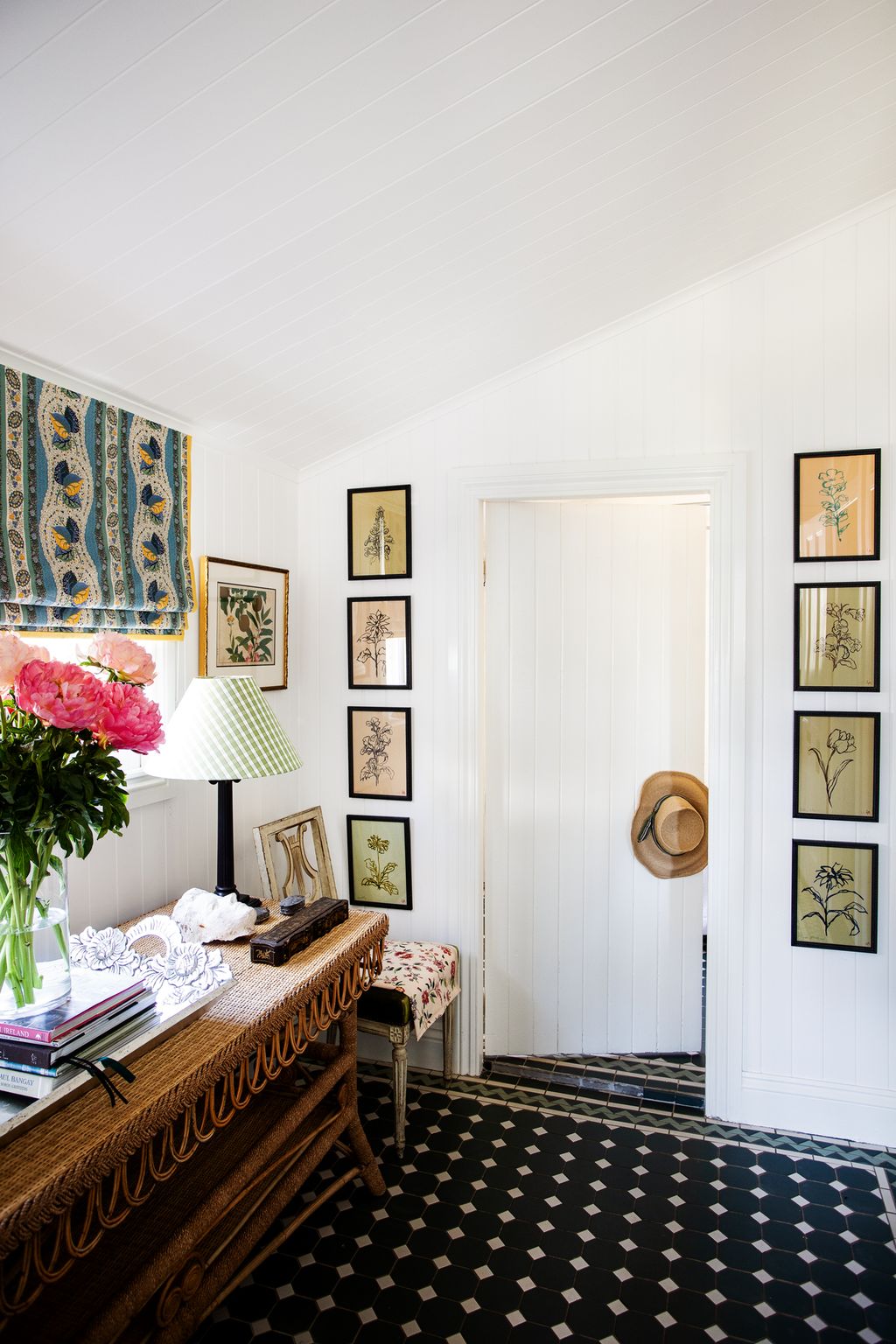 Image may contain Interior Design Indoors Living Room Room Plant Rug Home Decor Furniture Bedroom and Flower