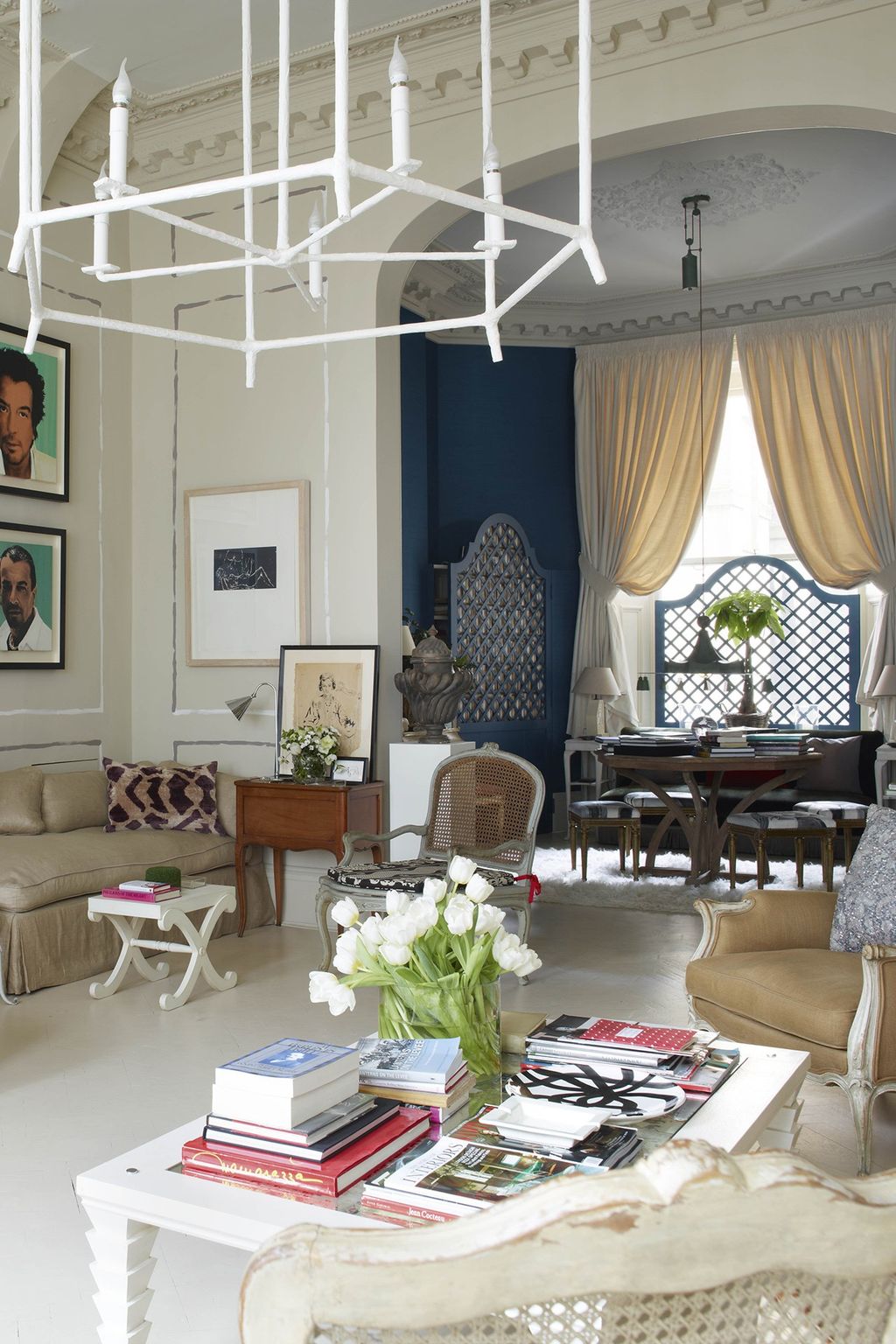 Image may contain Living Room Room Indoors Furniture Chair Human Person Couch Interior Design and Rug