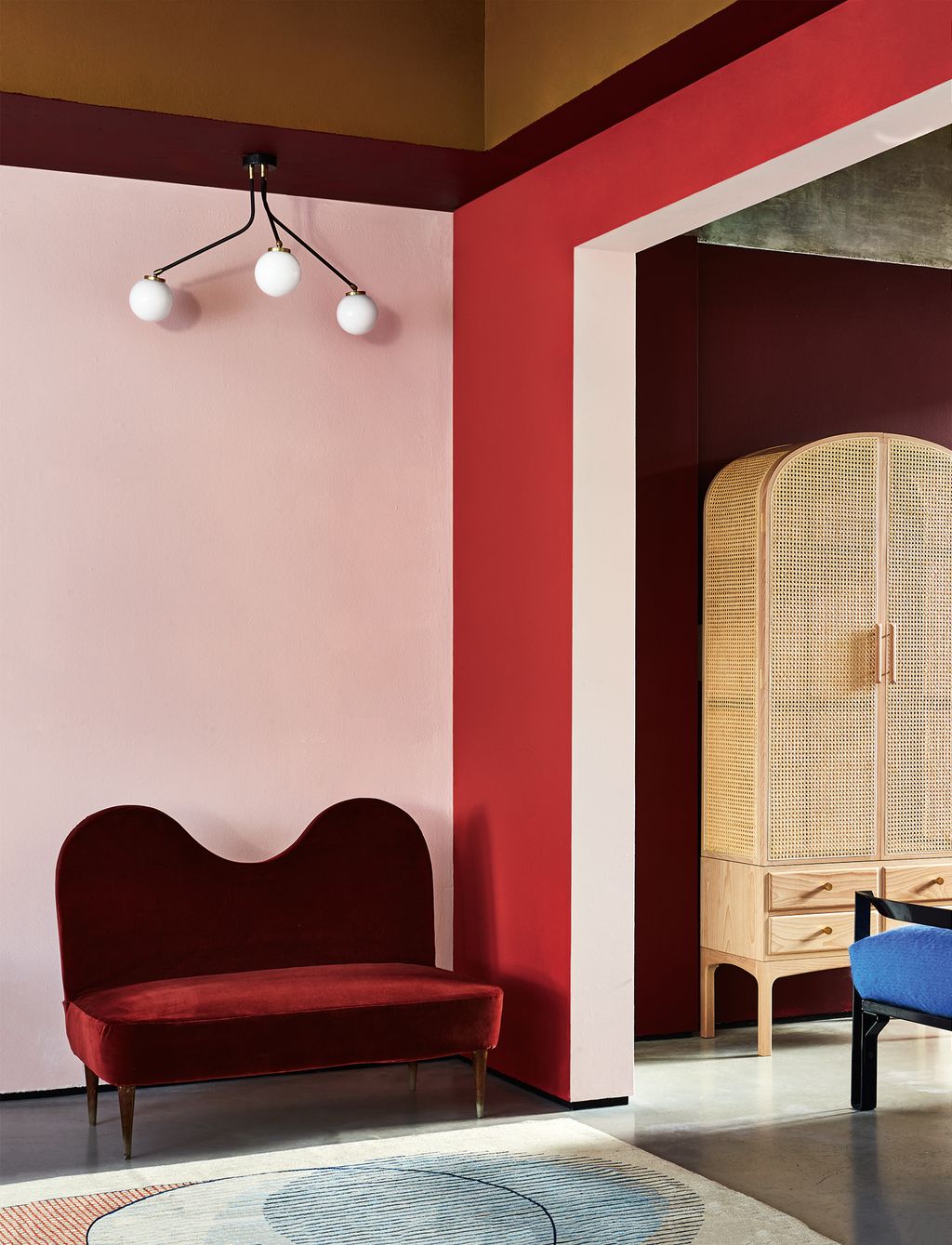 Image may contain Furniture Interior Design Indoors Living Room Room Couch Rug Appliance and Ceiling Fan