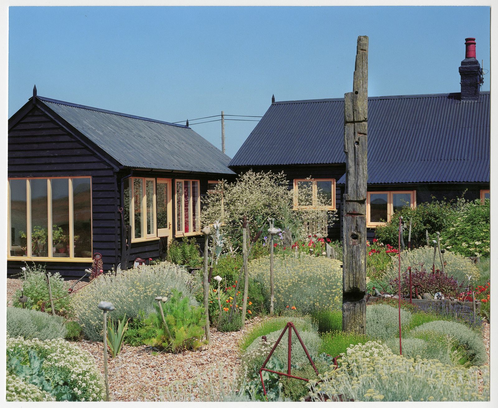 Image may contain House Cottage Housing Building Outdoors Yard Nature Human Person Plant Shelter and Countryside