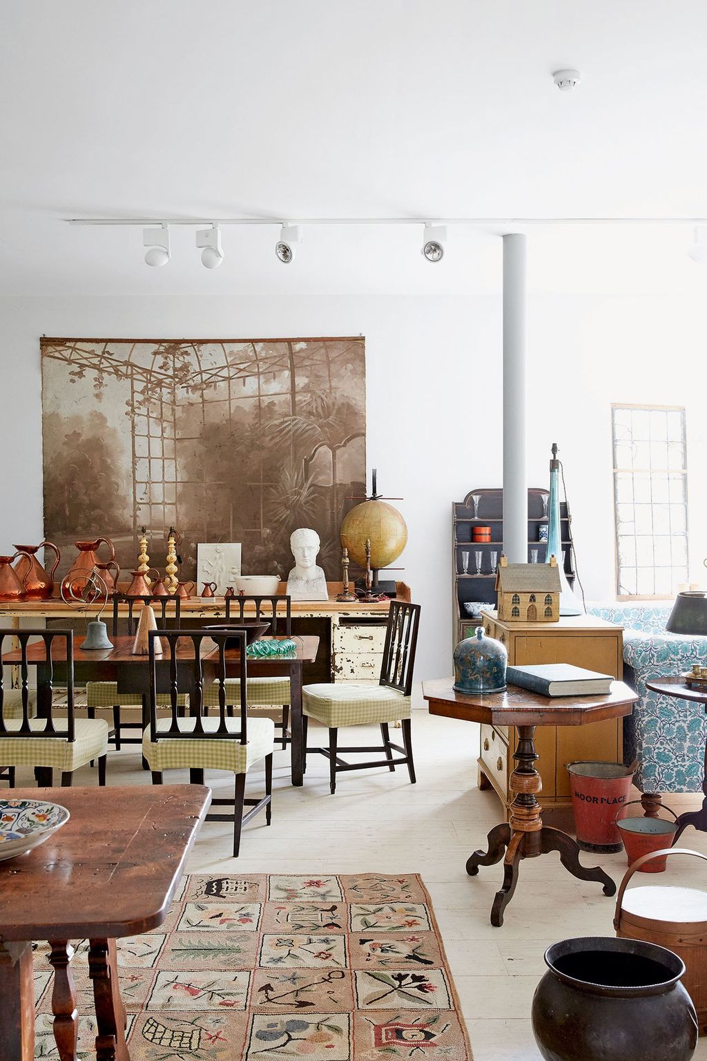 Image may contain Furniture Chair Indoors Interior Design Room Table Rug Dining Room Universe Space and Astronomy