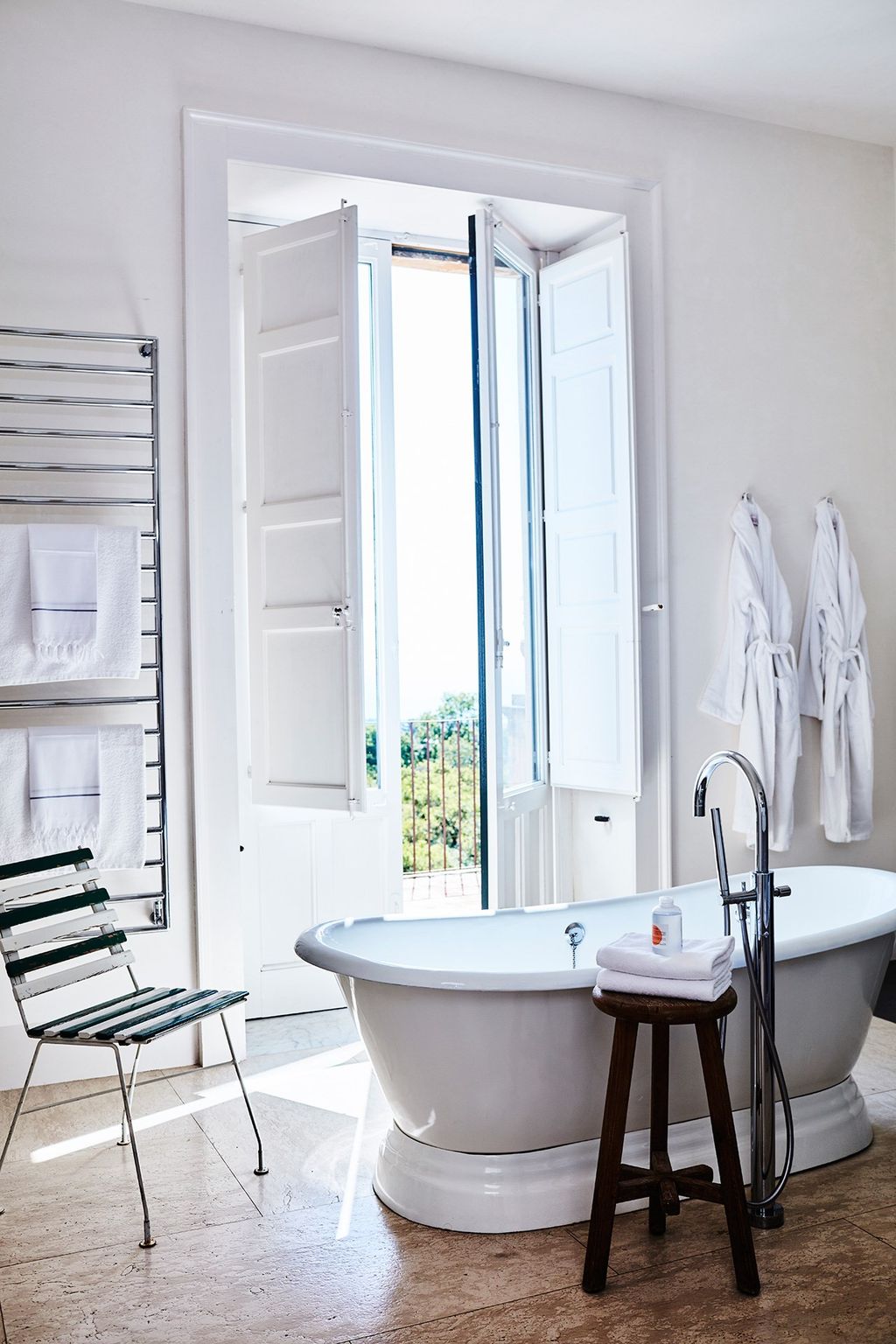 Image may contain Furniture Chair Tub Interior Design Indoors Bathtub and Room