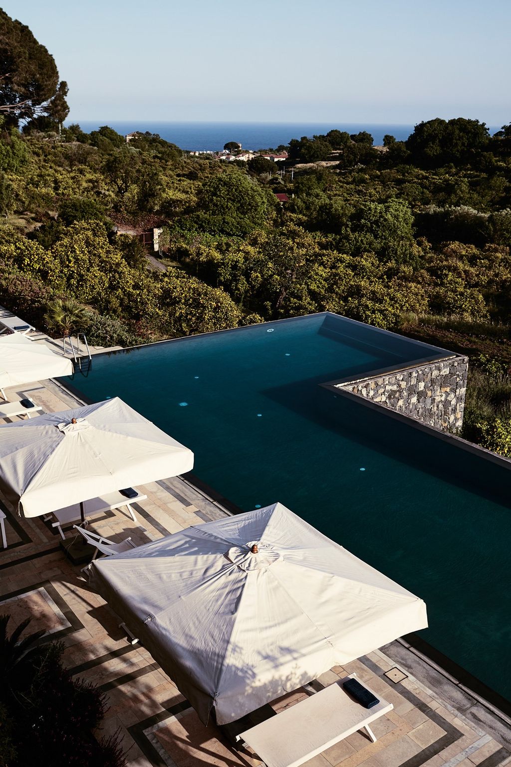 Image may contain Nature Outdoors Water Scenery Landscape Tent Pool Aerial View and Swimming Pool