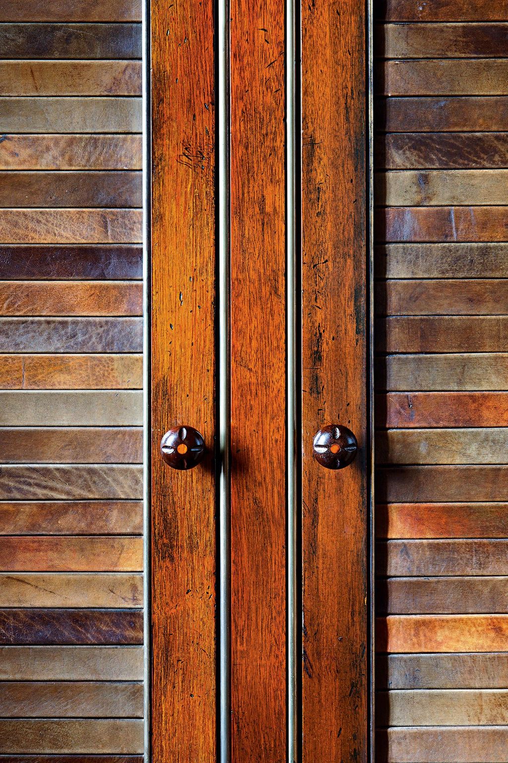 A pair of bespoke mahogany knobs is the elegant finishing touch to these cupboard doors. Created by Alidad for a...