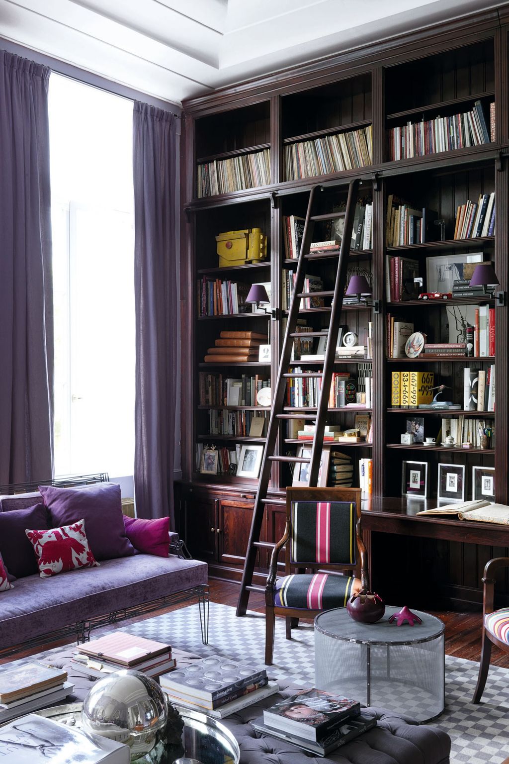 Image may contain Furniture Chair Bookcase Living Room Room Indoors Shelf Couch Helmet Clothing and Apparel