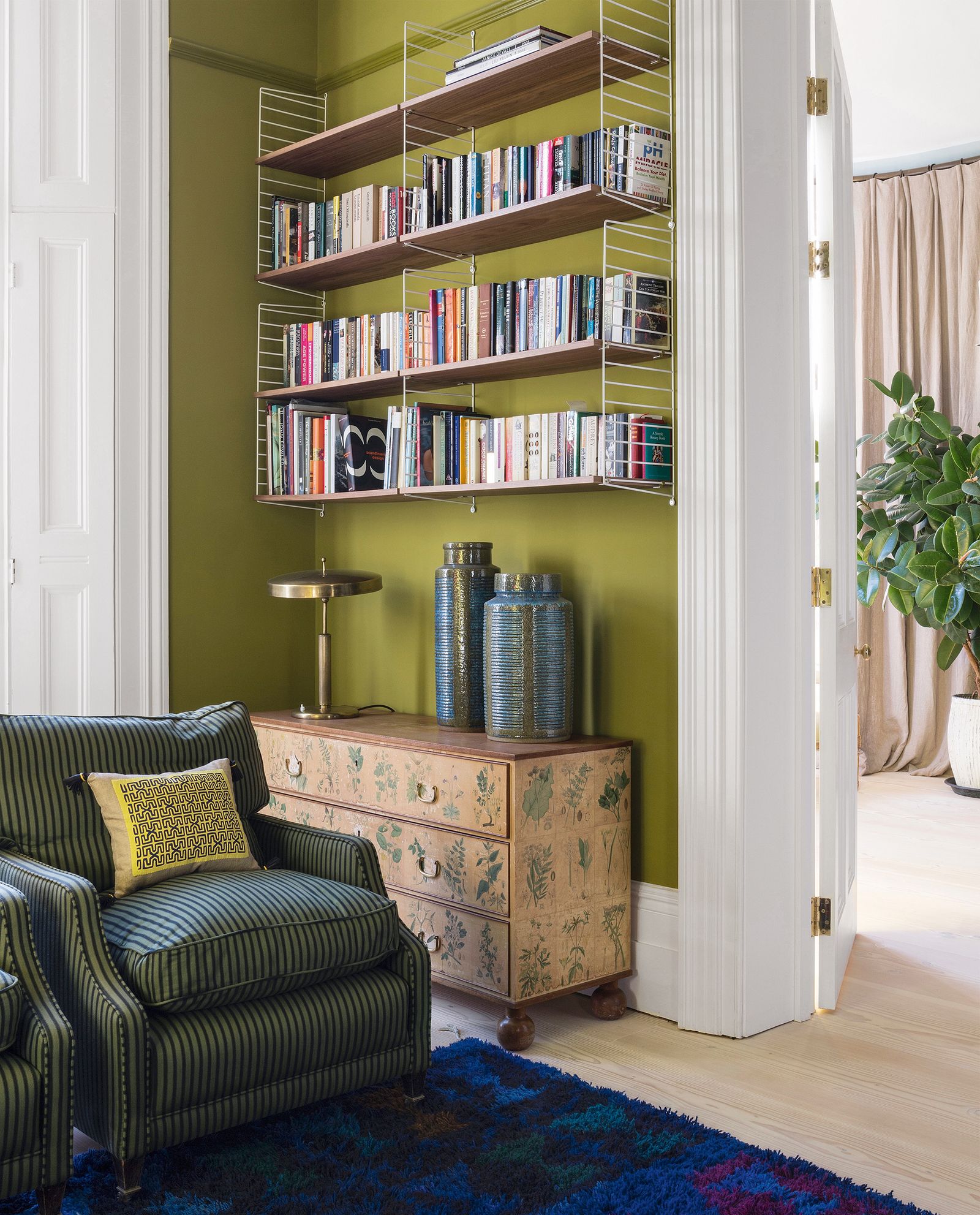 A blue Scandinavian rug provides a splash of contrasting colour.