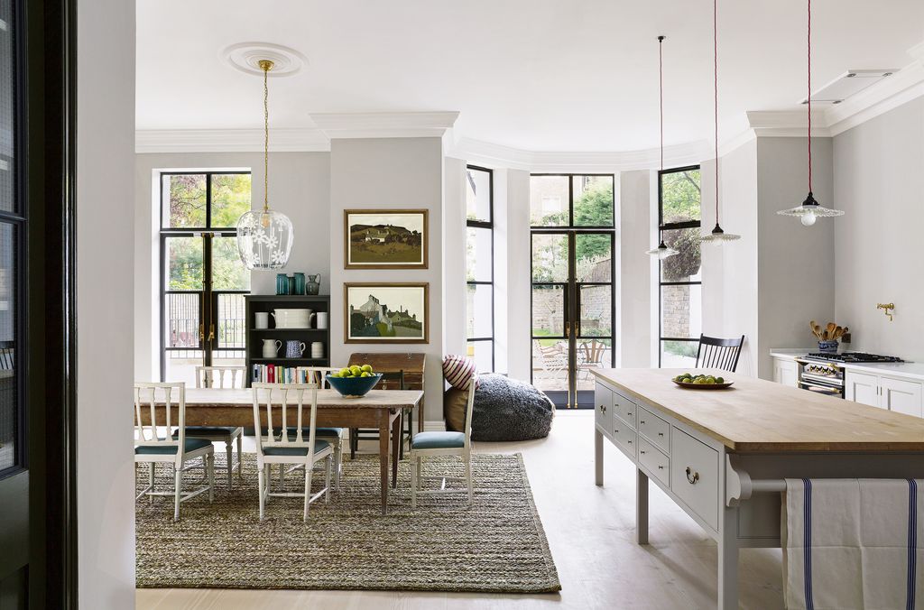 Image may contain Furniture Chair Indoors Room Dining Room Rug Table and Living Room