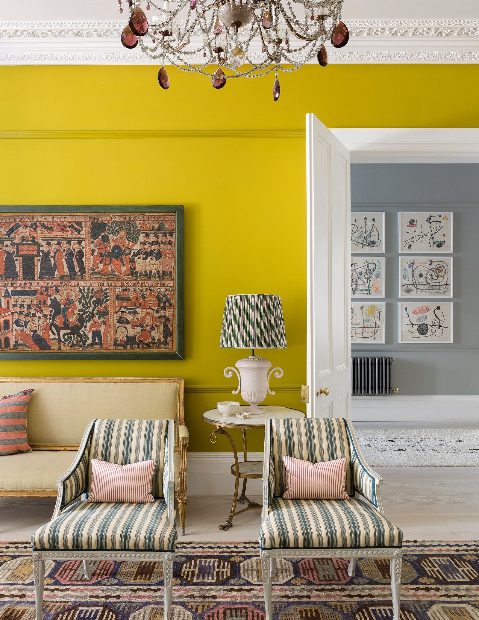 Image may contain Furniture Interior Design Indoors Living Room Room Lamp Table Lamp Chandelier Cushion and Bedroom