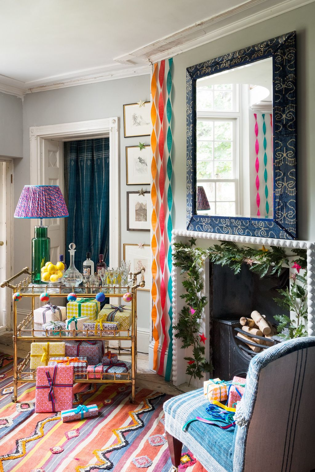 Image may contain Lamp Living Room Room Indoors Furniture Table Lamp Human and Person