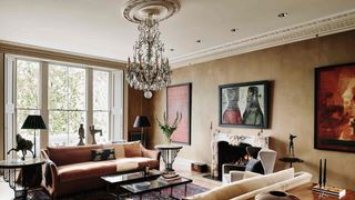 Image may contain Living Room Room Indoors Furniture Interior Design Couch Table Lamp Chandelier and Flooring