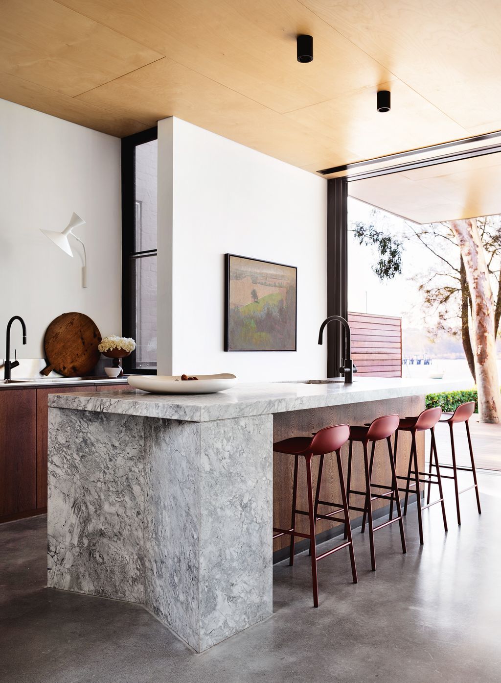 Image may contain Furniture Indoors Room Bar Stool and Kitchen Island