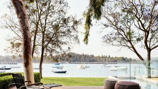 Image may contain Furniture Vehicle Transportation Boat Cushion Pillow Table Porch Deck Wood and Coffee Table