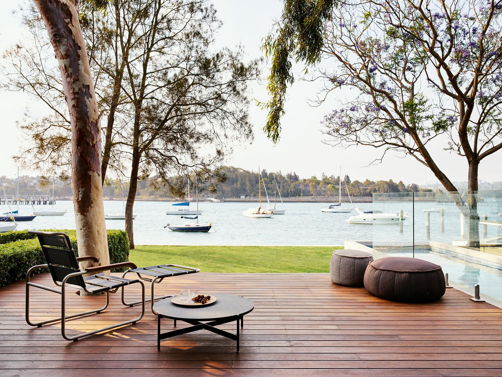 Image may contain Furniture Vehicle Transportation Boat Cushion Pillow Table Porch Deck Wood and Coffee Table