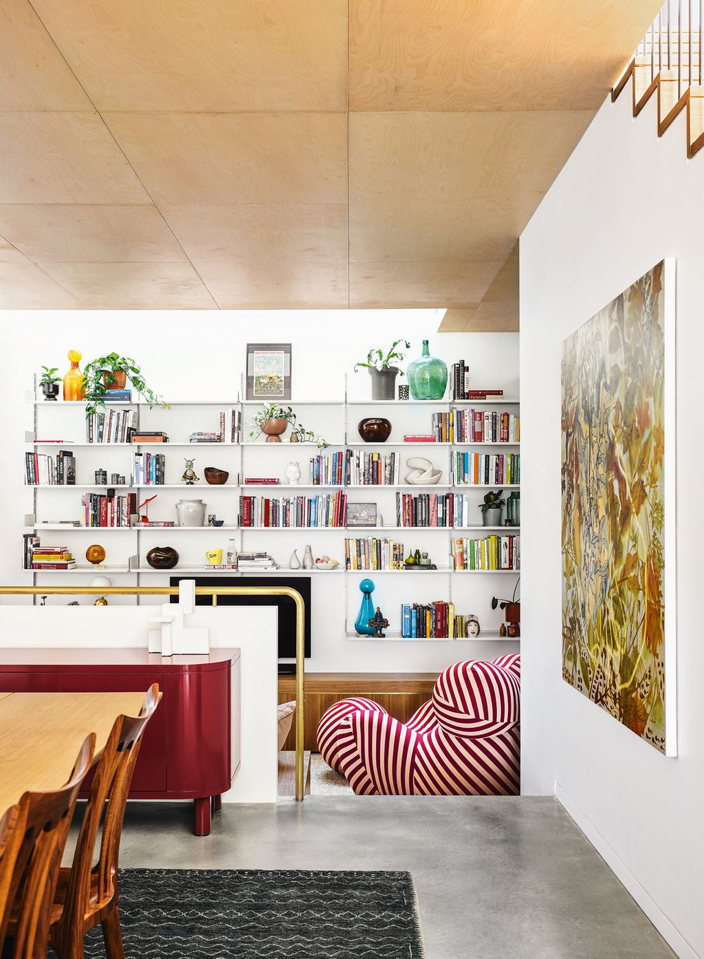 Image may contain Furniture Shelf Interior Design Indoors Chair Wood Living Room Room and Table