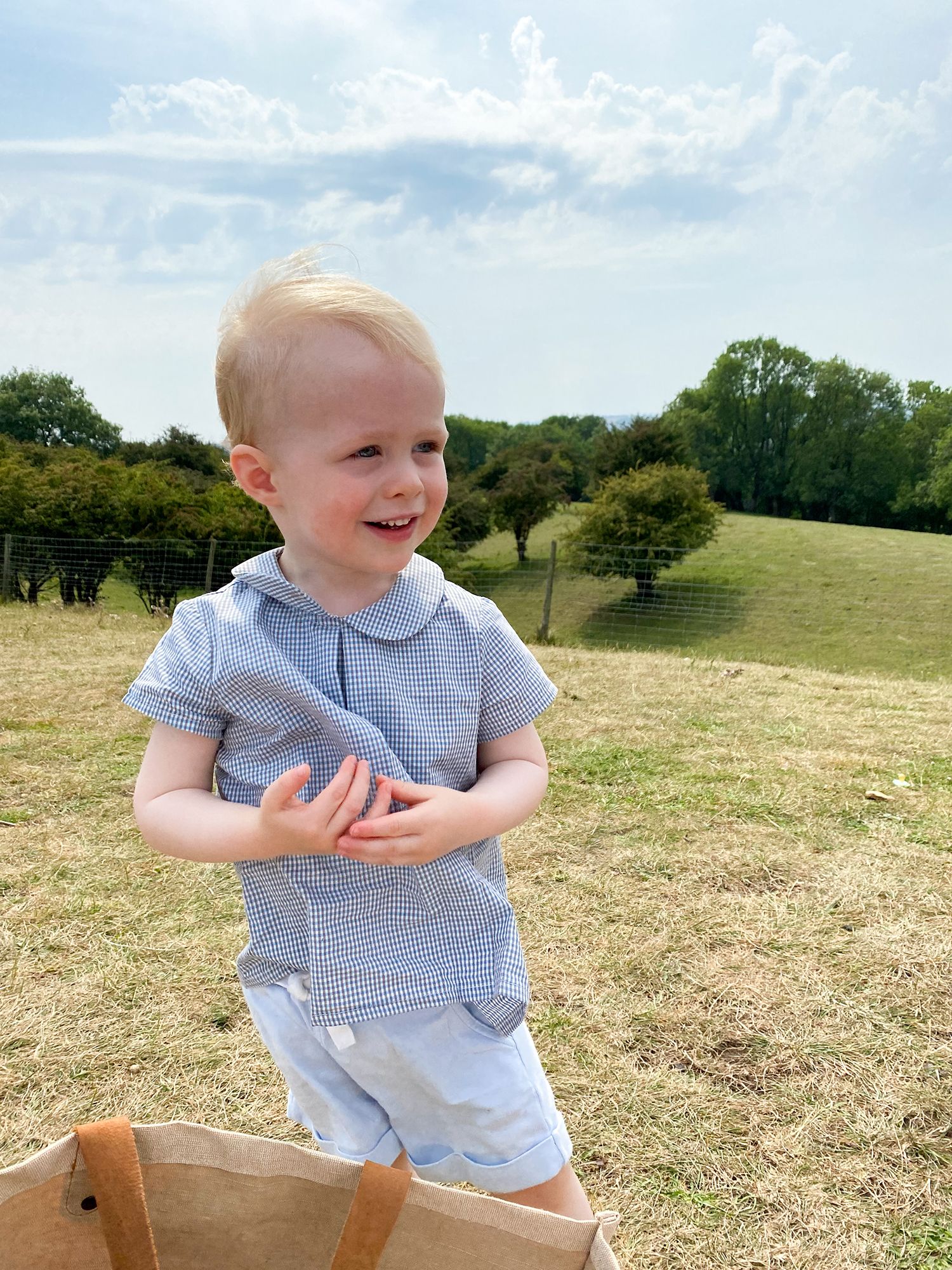 Image may contain Grass Plant Clothing Apparel Pants Human Person Face Shorts and Outdoors