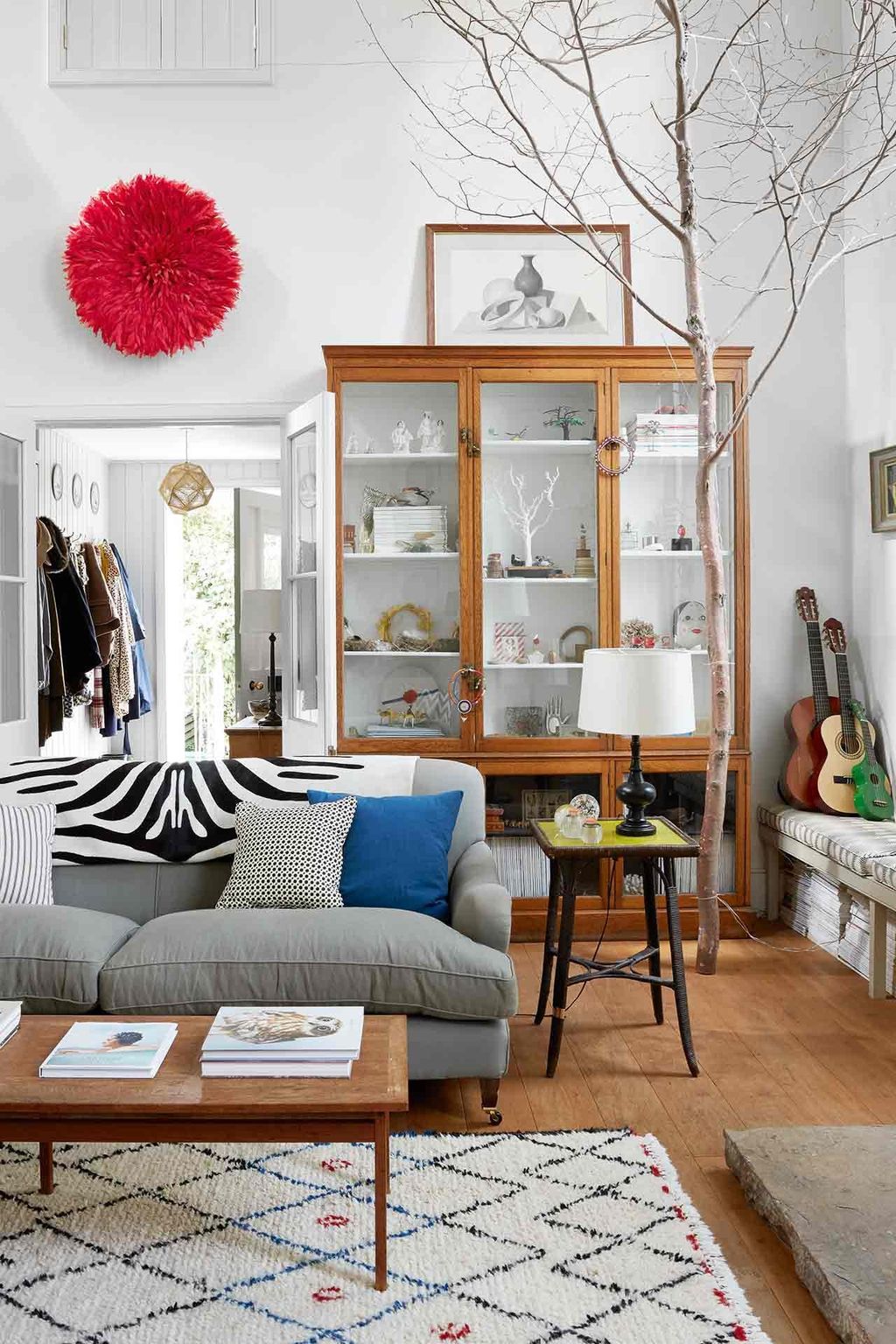 Image may contain Furniture Indoors Room Living Room Rug Table Cushion Interior Design and Wood