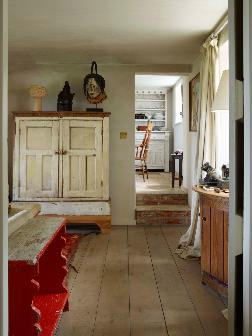 Image may contain Flooring Floor Wood Hardwood Living Room Room Indoors Furniture Interior Design and Couch