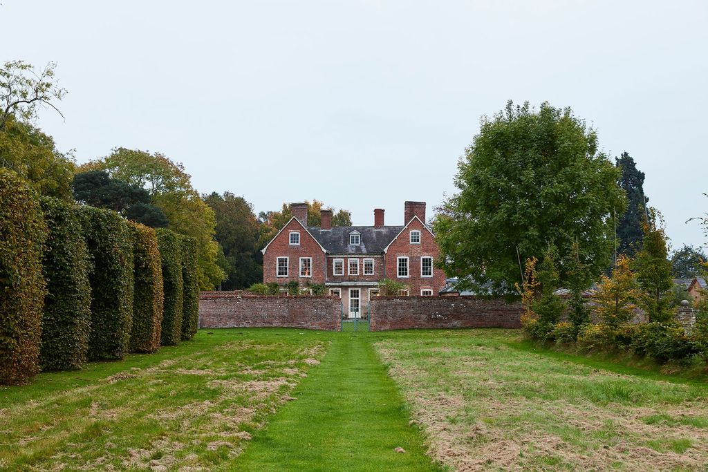 A low wall visible from the approach to the house.