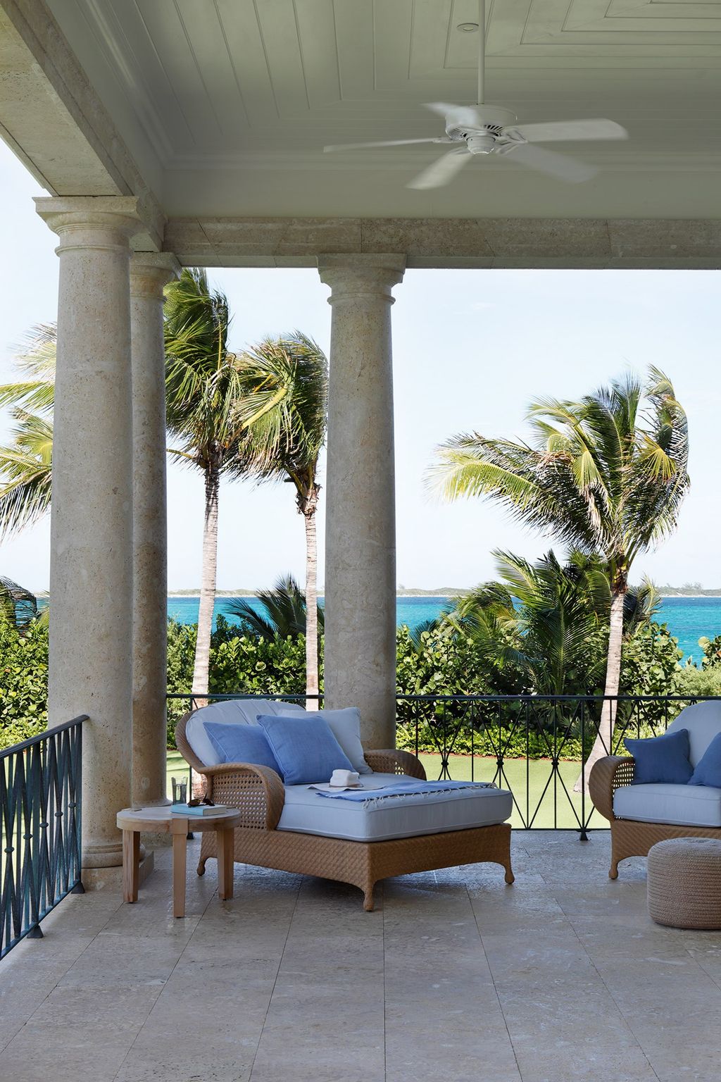 Image may contain Furniture Couch Ceiling Fan Appliance Table Indoors Interior Design Patio Living Room and Room