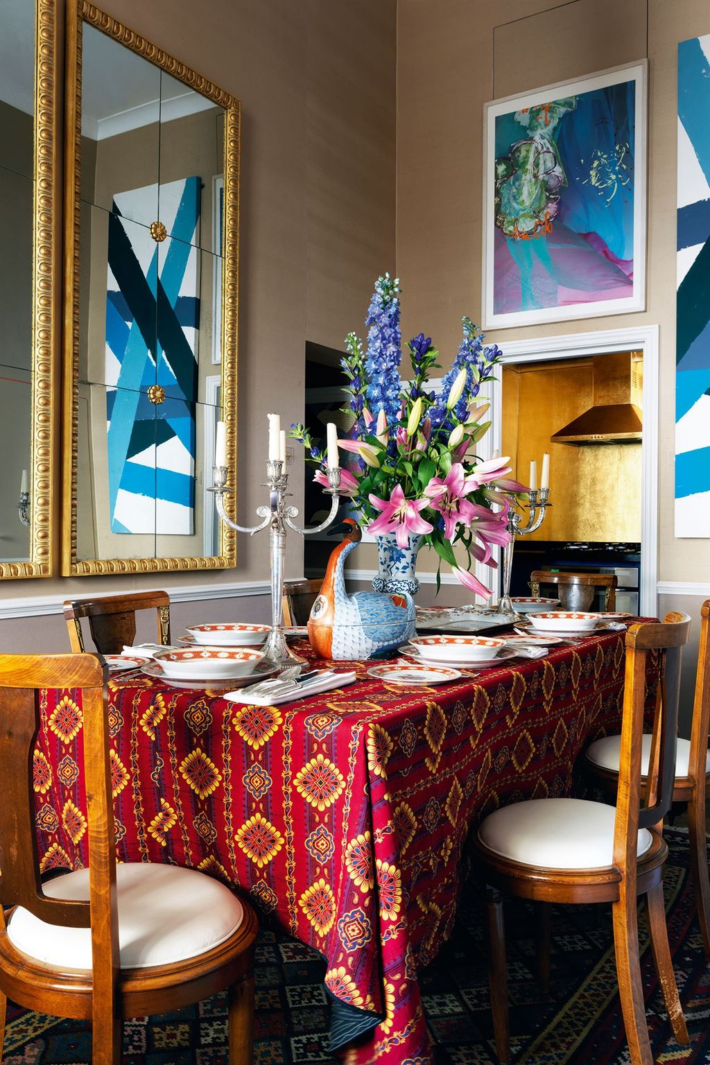 The artwork in the dining room includes a painting by Alf Löhr from Broadbent Gallery and a graphic piece based on a...