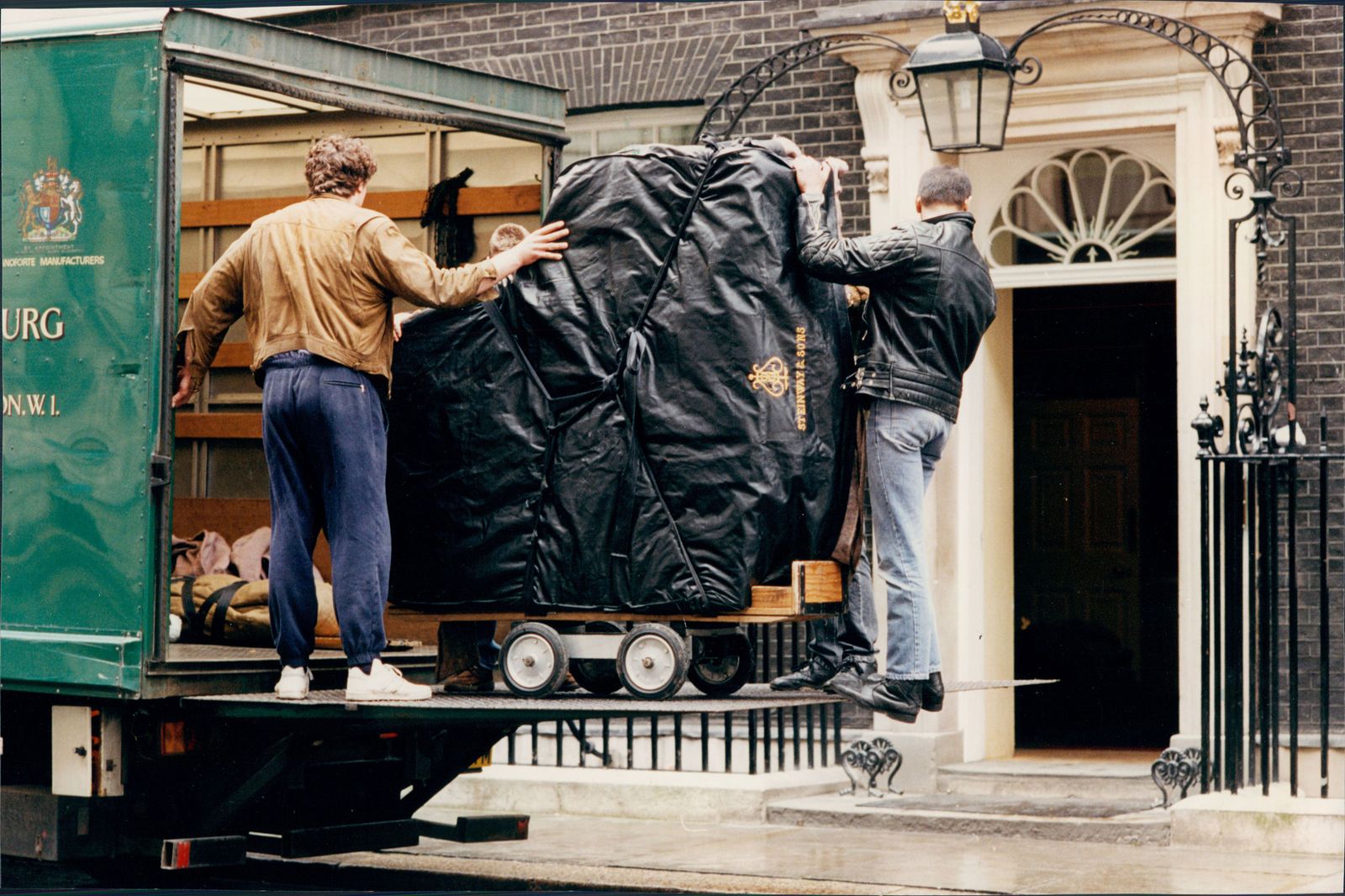 Image may contain Human Person Clothing Apparel Pants Coat Denim Jeans and Brick