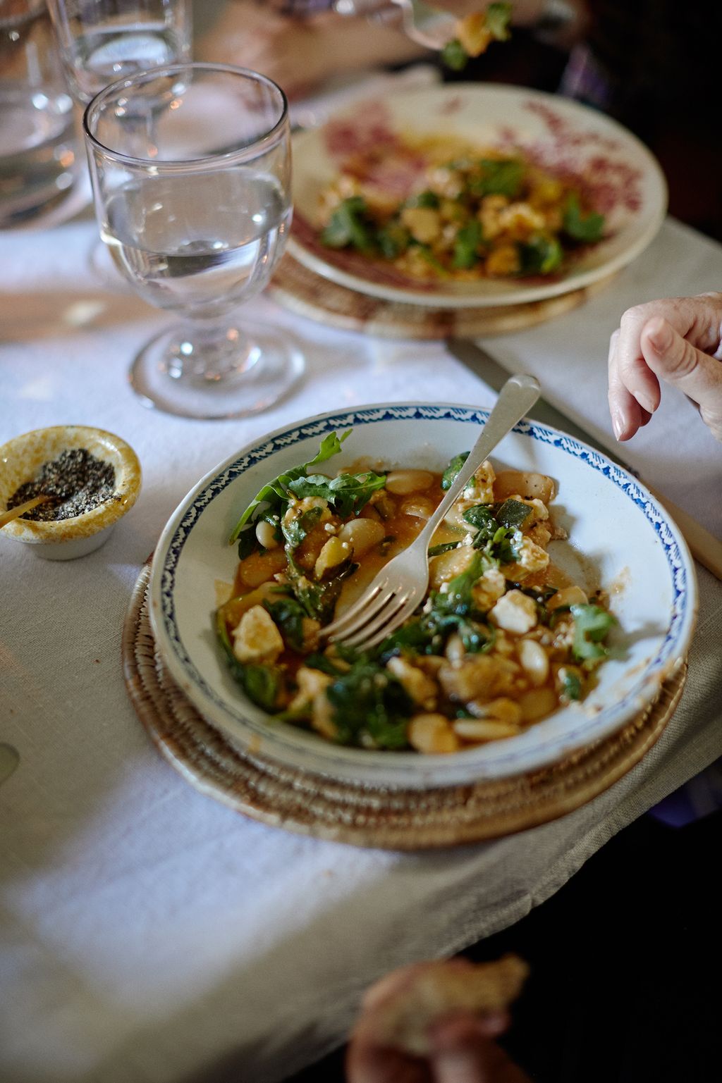 Image may contain Food Dish Meal Bowl Plant Pizza Human Person Furniture Dining Table and Table