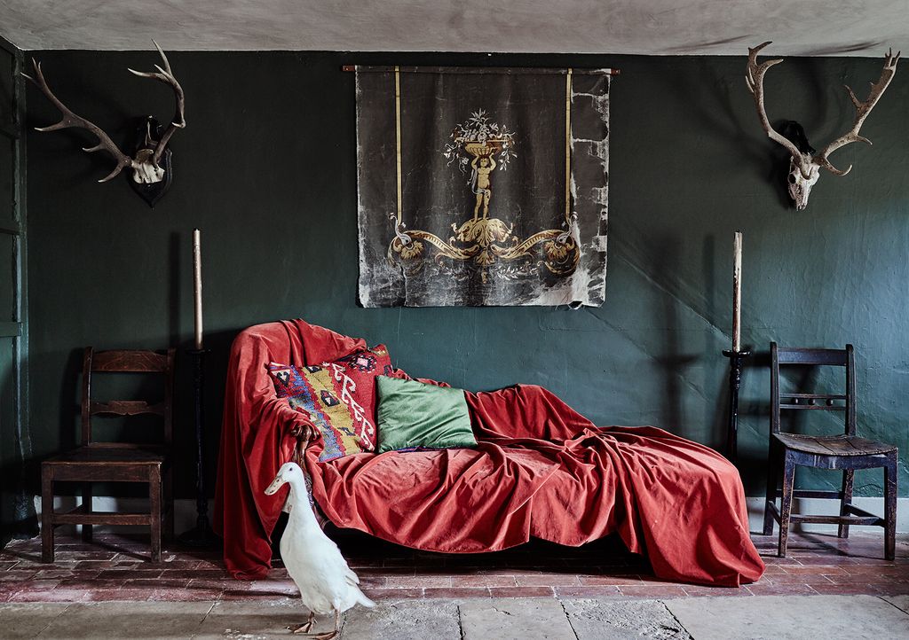 A duck from the farm wanders into the drawing room where a Victorian chaise is covered in silk velvet.