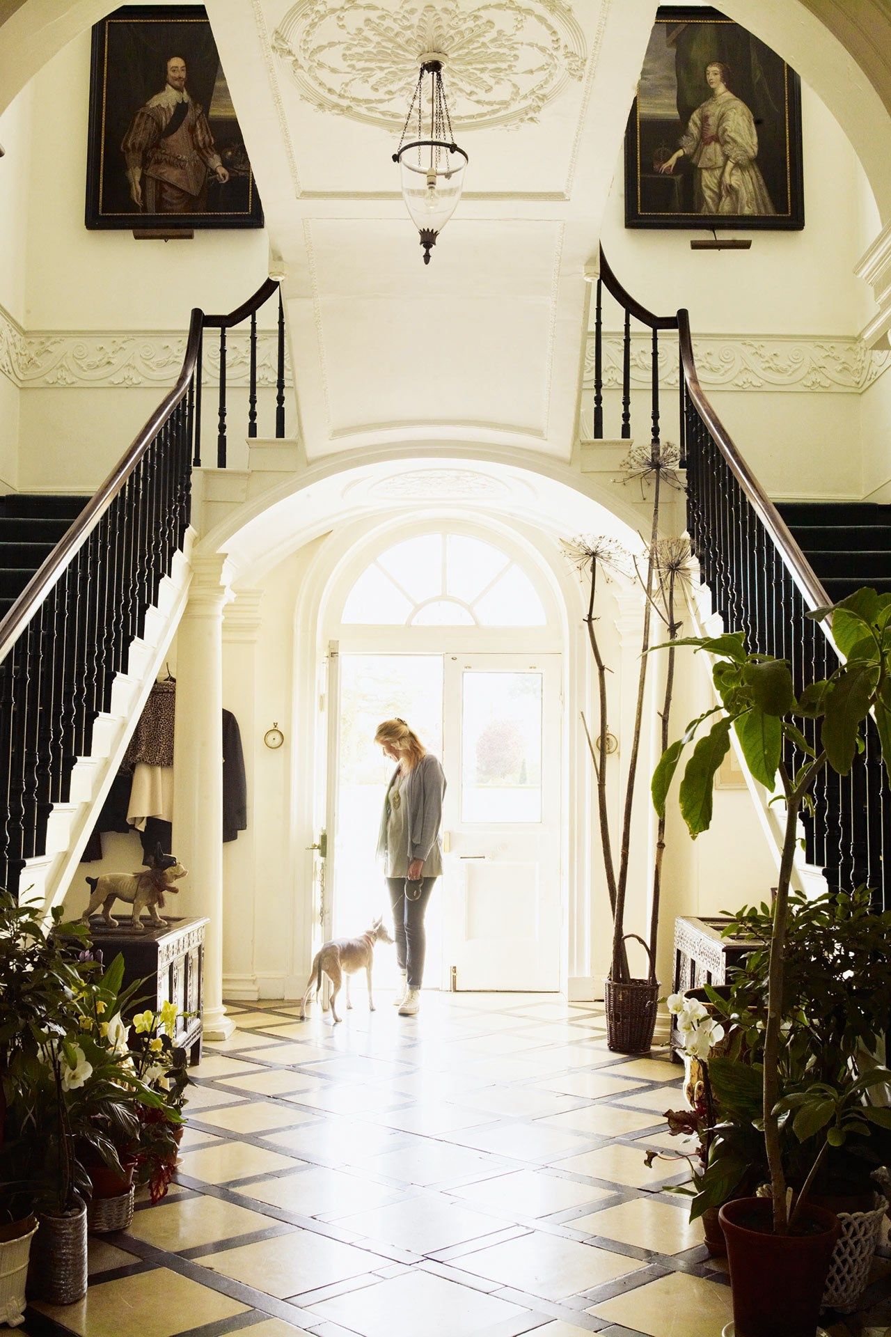 Image may contain Banister Handrail Human Person Indoors Interior Design Flooring Clothing Shoe and Footwear