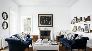 Image may contain Living Room Room Indoors Furniture Couch Flooring Wood Interior Design Table and Hardwood