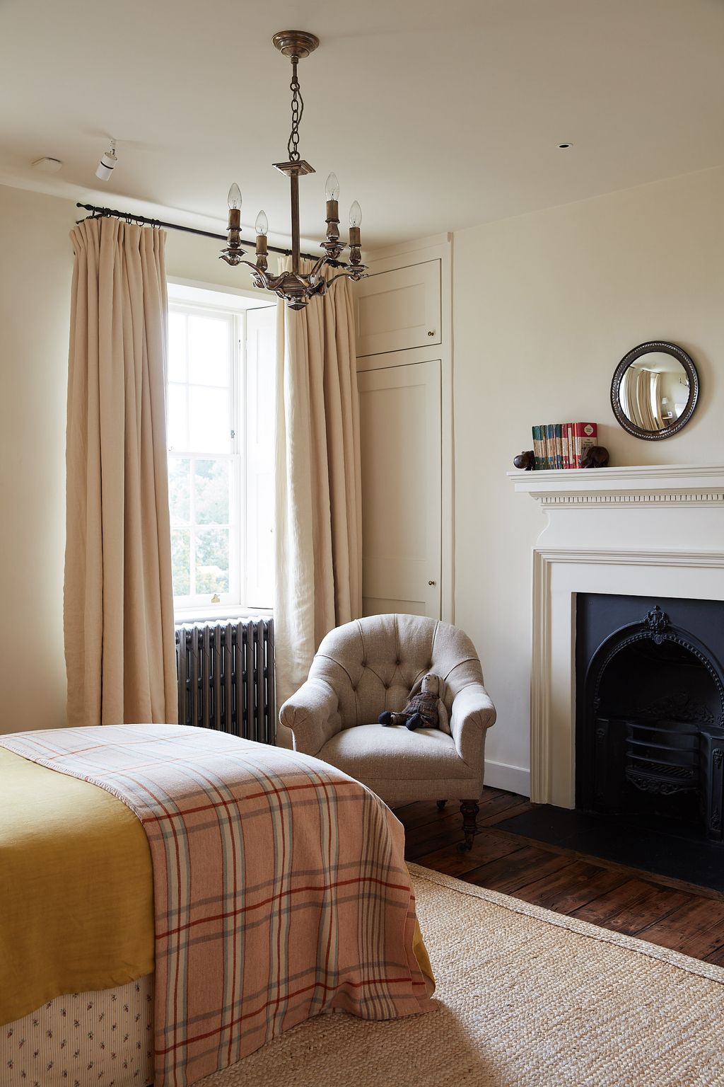 Image may contain Furniture Indoors Interior Design Room Living Room Fireplace and Bed