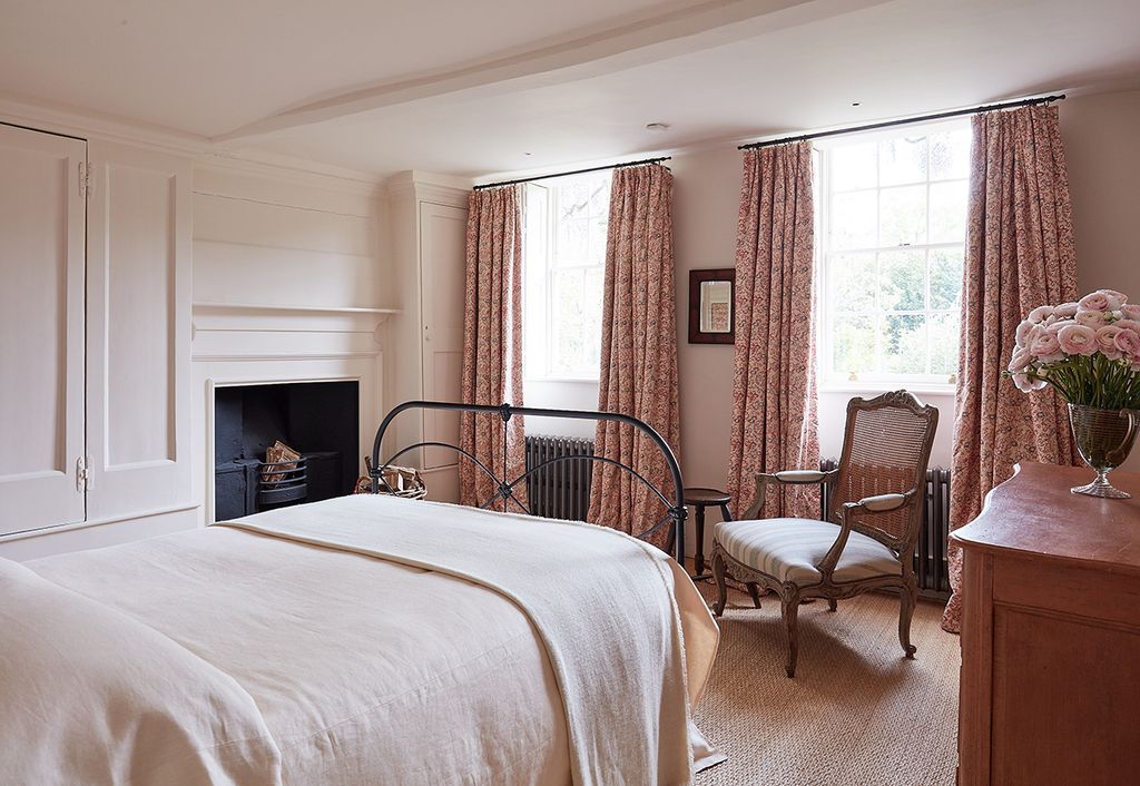 Image may contain Room Bedroom Indoors Furniture Bed Flooring Floor Chair and Wood