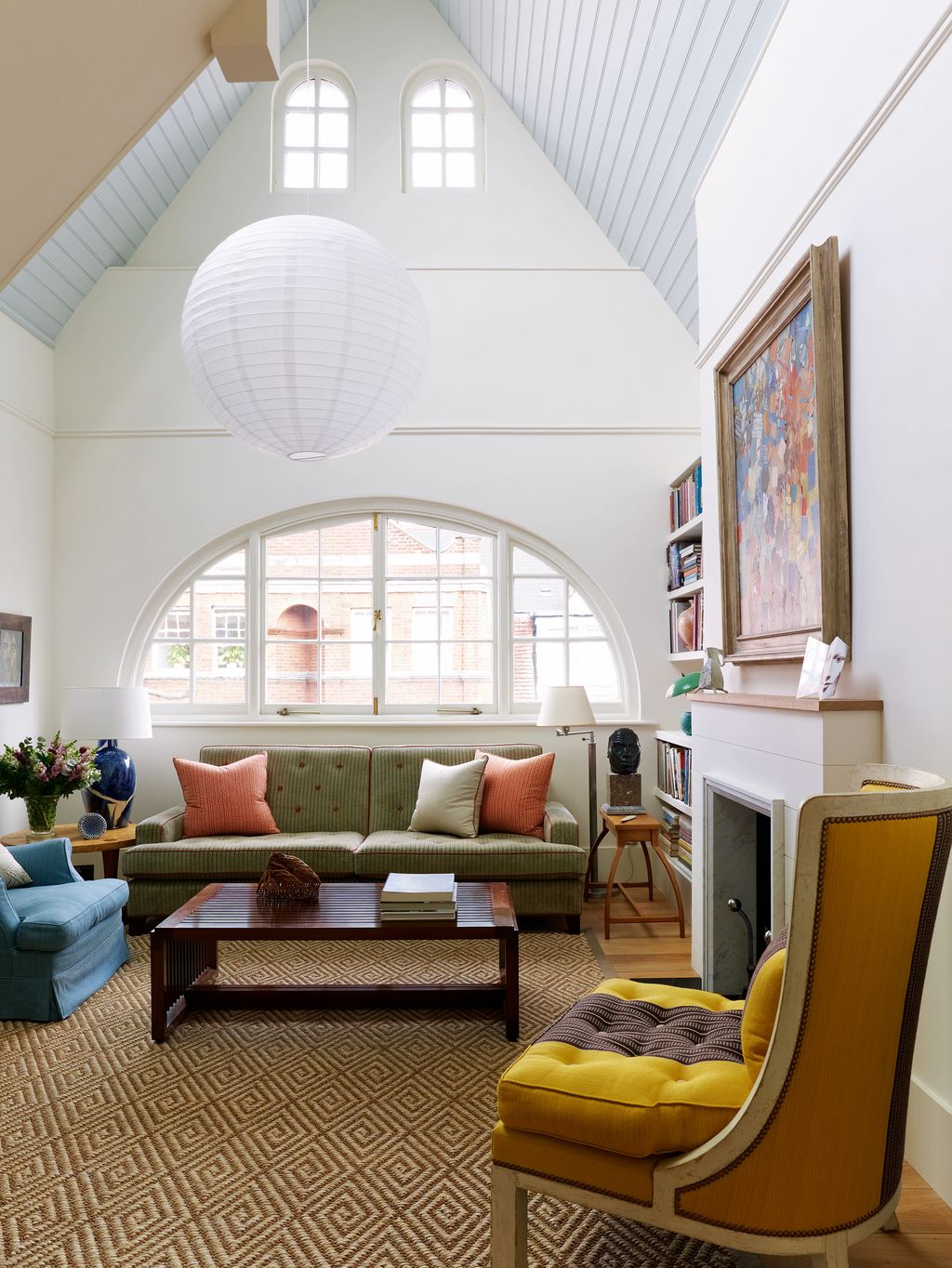 Image may contain Furniture Table Coffee Table Living Room Room Indoors Cushion Pillow Rug and Couch