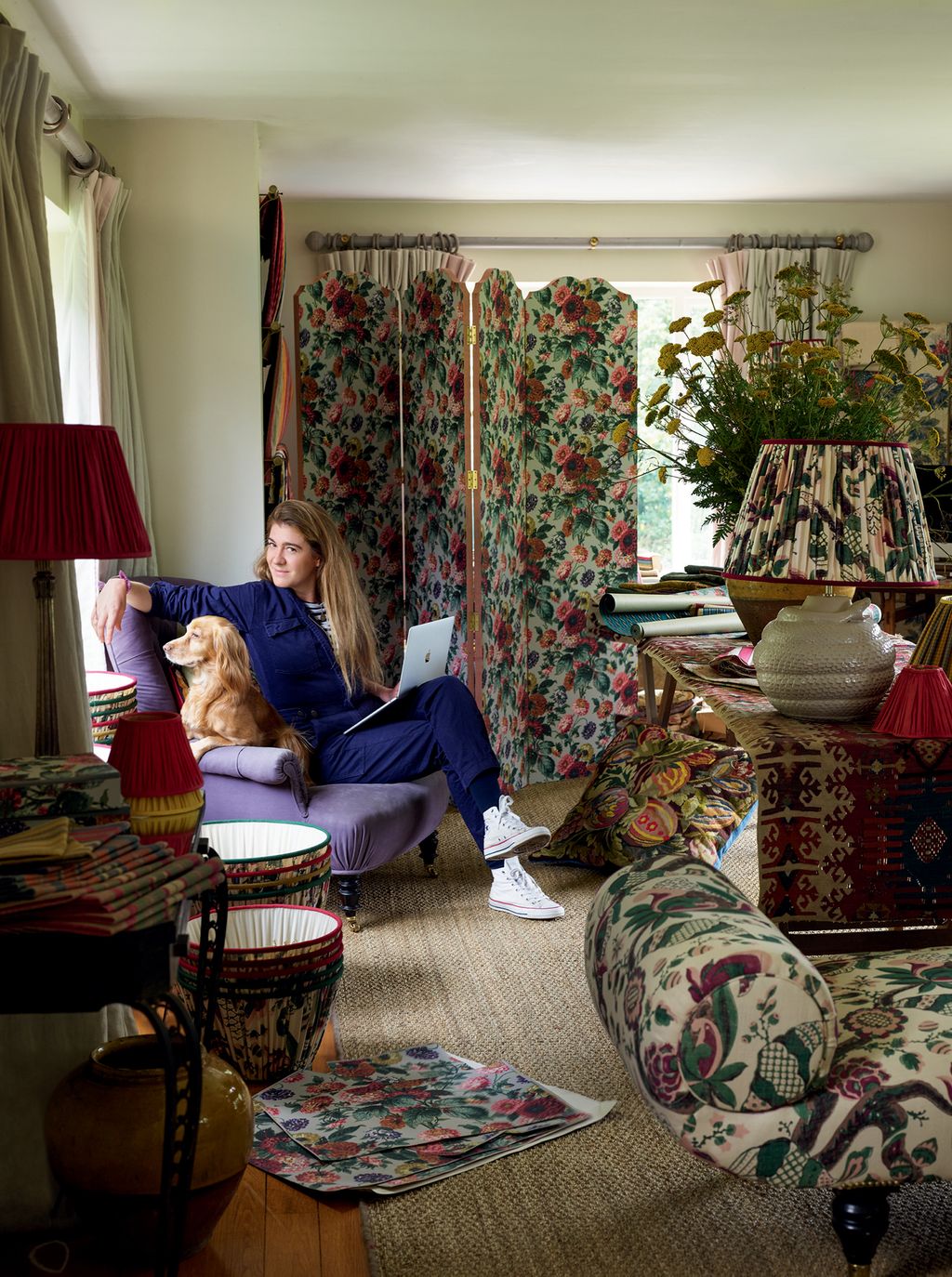 Image may contain Living Room Room Indoors Furniture Couch Human Person Interior Design Electronics and Monitor