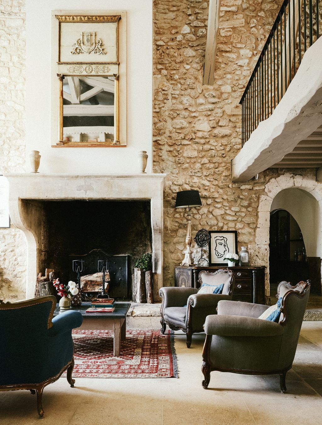 Image may contain Furniture Living Room Room Indoors Fireplace Couch and Chair