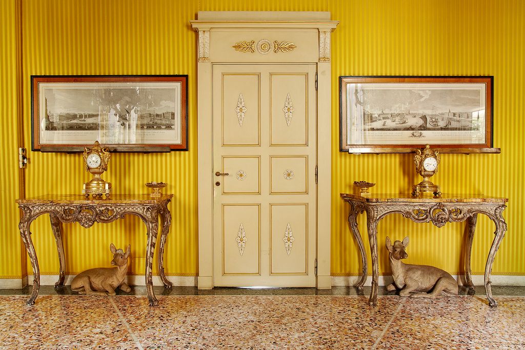 Image may contain Flooring Furniture Floor Door Wood Home Decor Couch Hardwood Living Room Room and Indoors