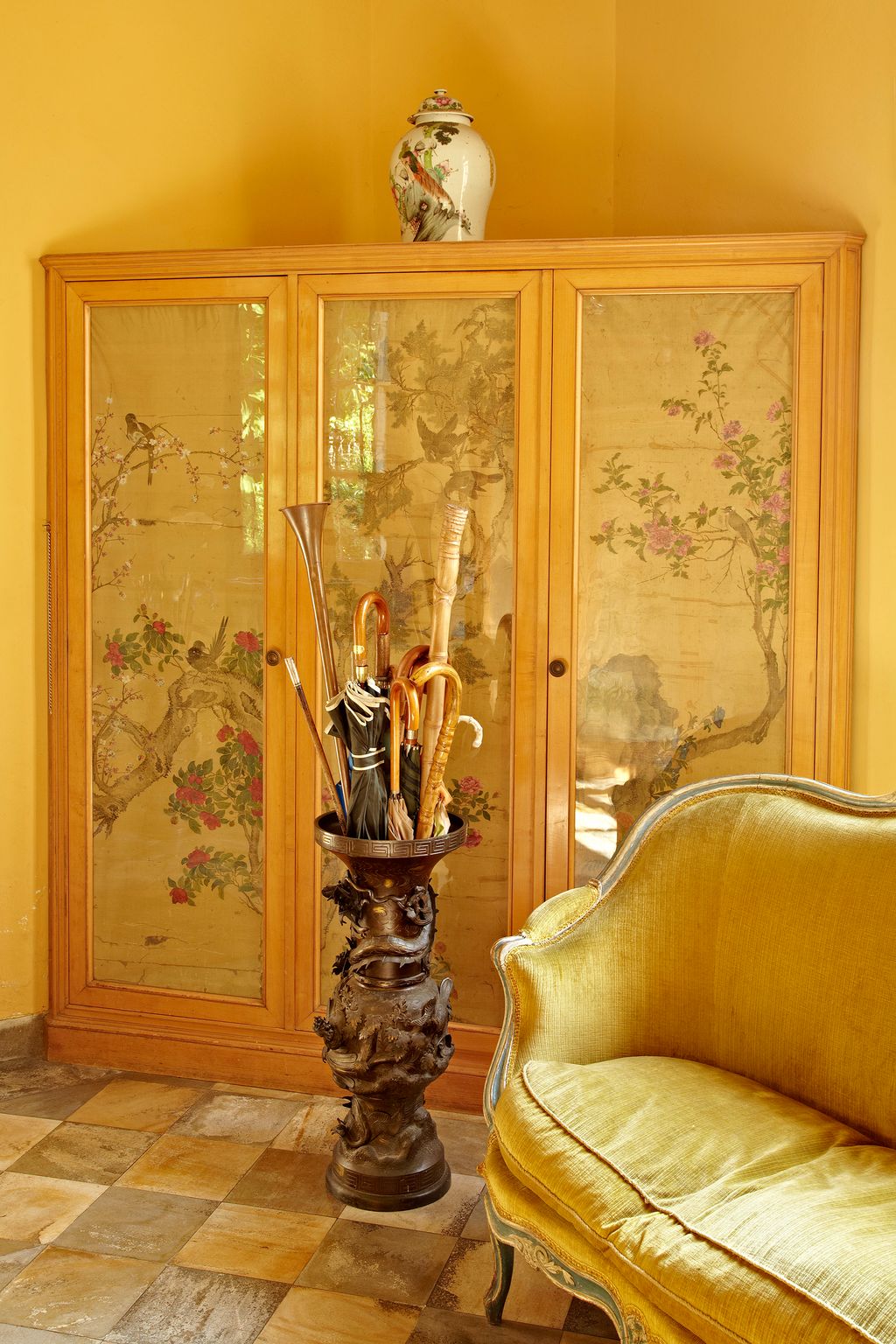 Image may contain Furniture Wood Cupboard Closet Floor Hardwood Flooring Couch and Home Decor