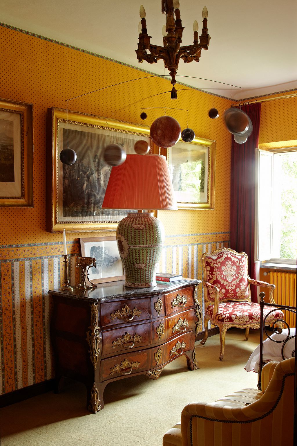 Image may contain Lamp Table Lamp Furniture Interior Design Indoors Living Room Room and Chair