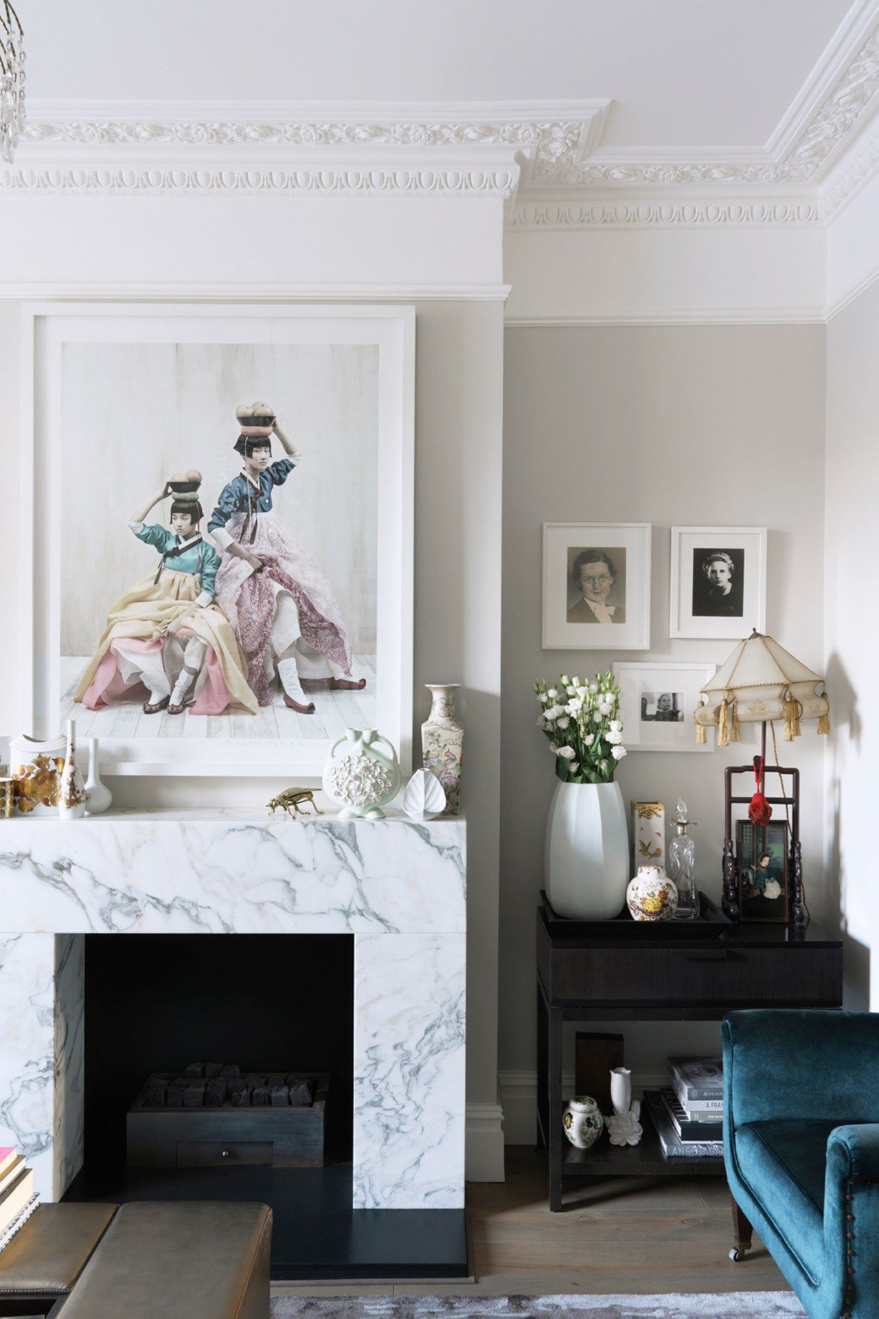 Image may contain Indoors Fireplace Interior Design Living Room Room Furniture Hearth Human and Person