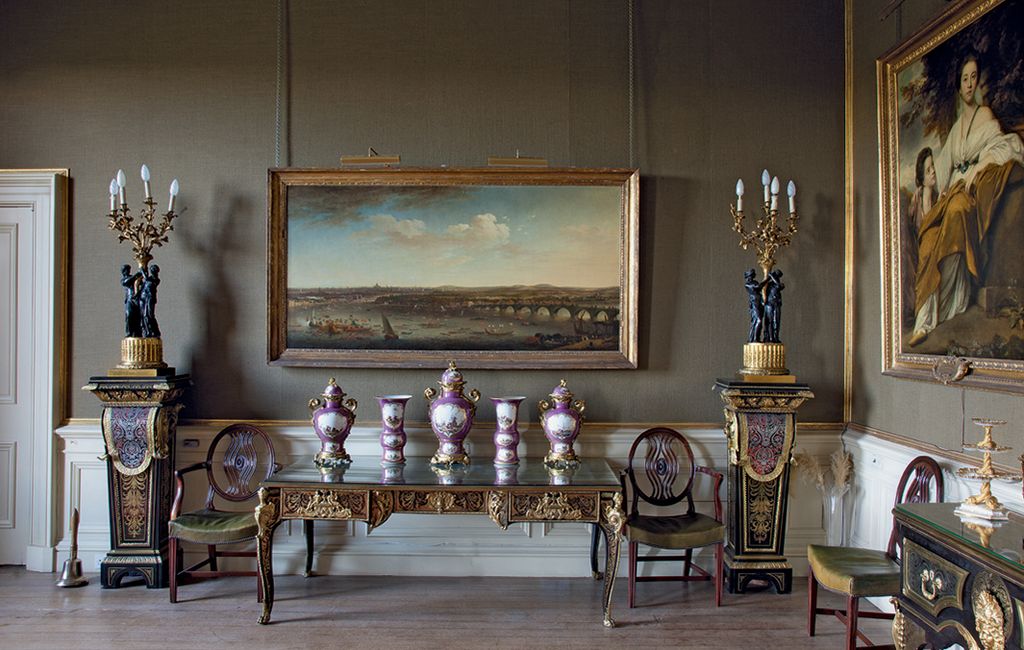 Image may contain Furniture Flooring Interior Design Indoors Chair Living Room Room Floor Wood and Clock Tower