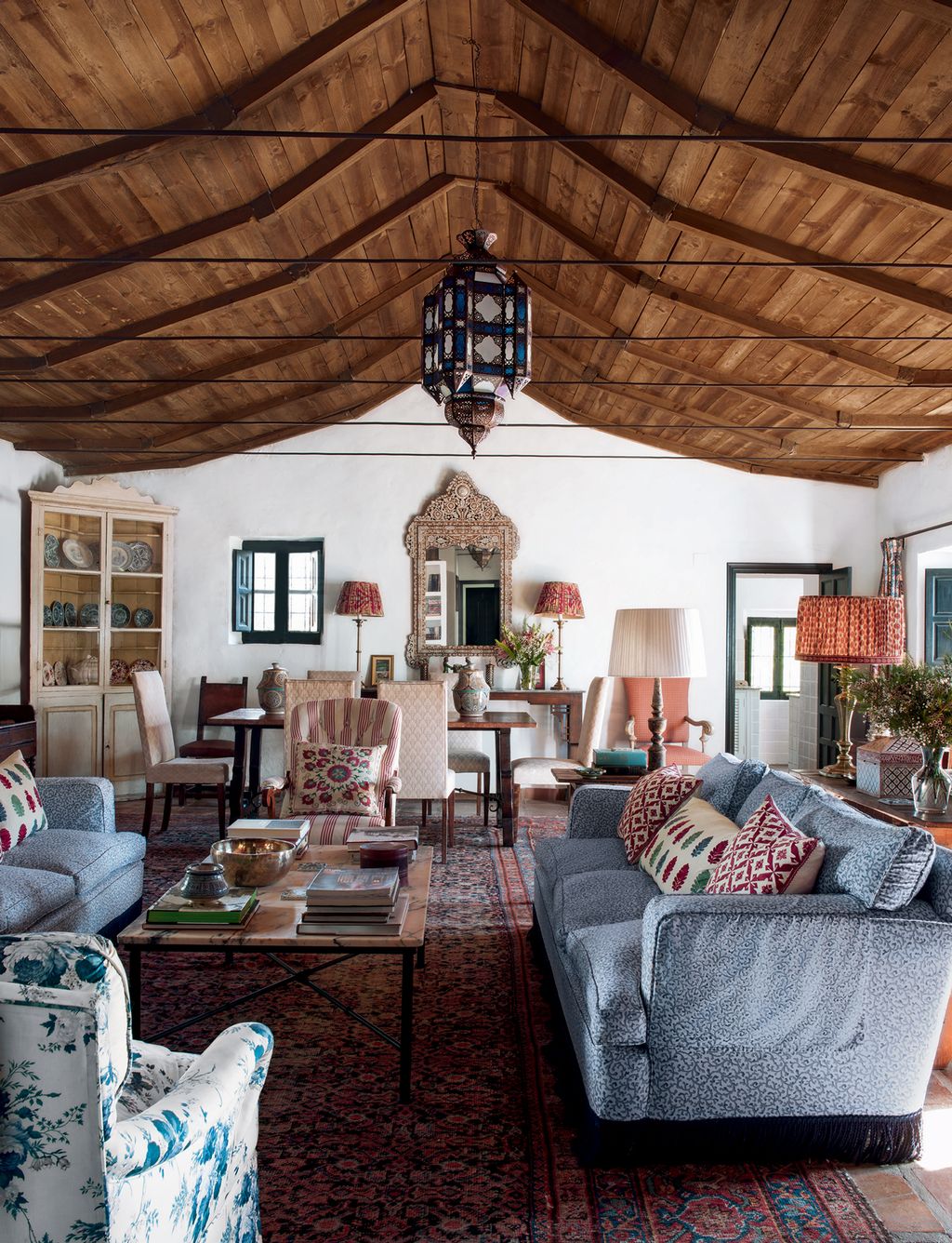 Image may contain Living Room Room Indoors Furniture Couch Table Chair Wood Lobby Interior Design and Coffee Table