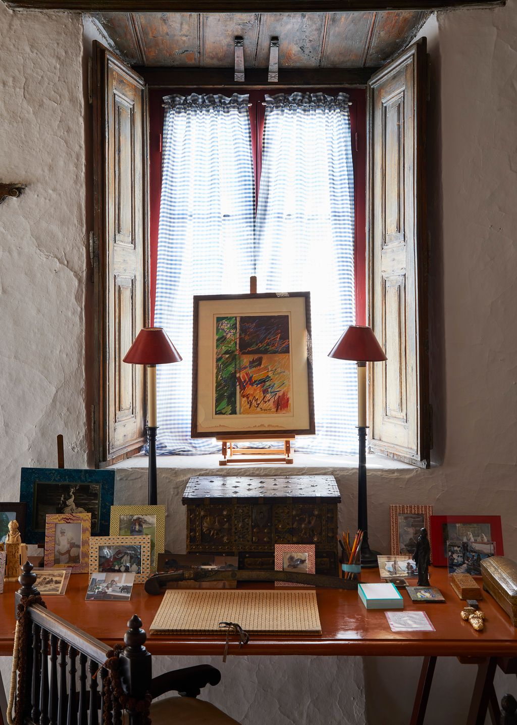 A simple trestle table made on the island serves as a desk.