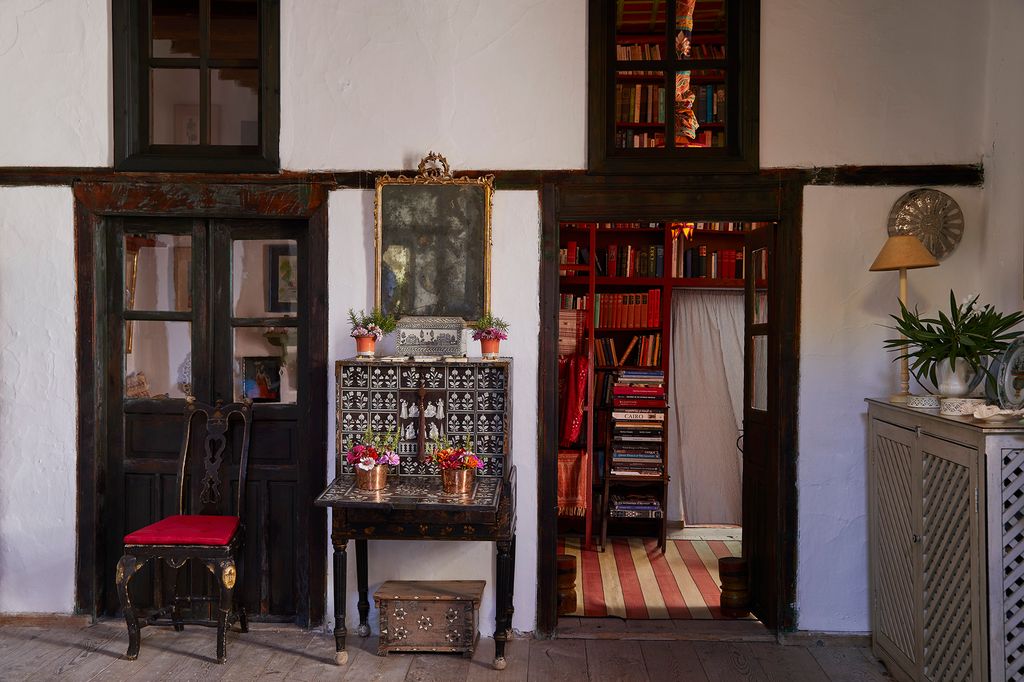 Image may contain Furniture Shelf Bookcase Interior Design Indoors Flooring Wood and Hardwood