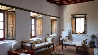 Image may contain Living Room Room Indoors Furniture Couch Flooring Housing Building Wood and Interior Design