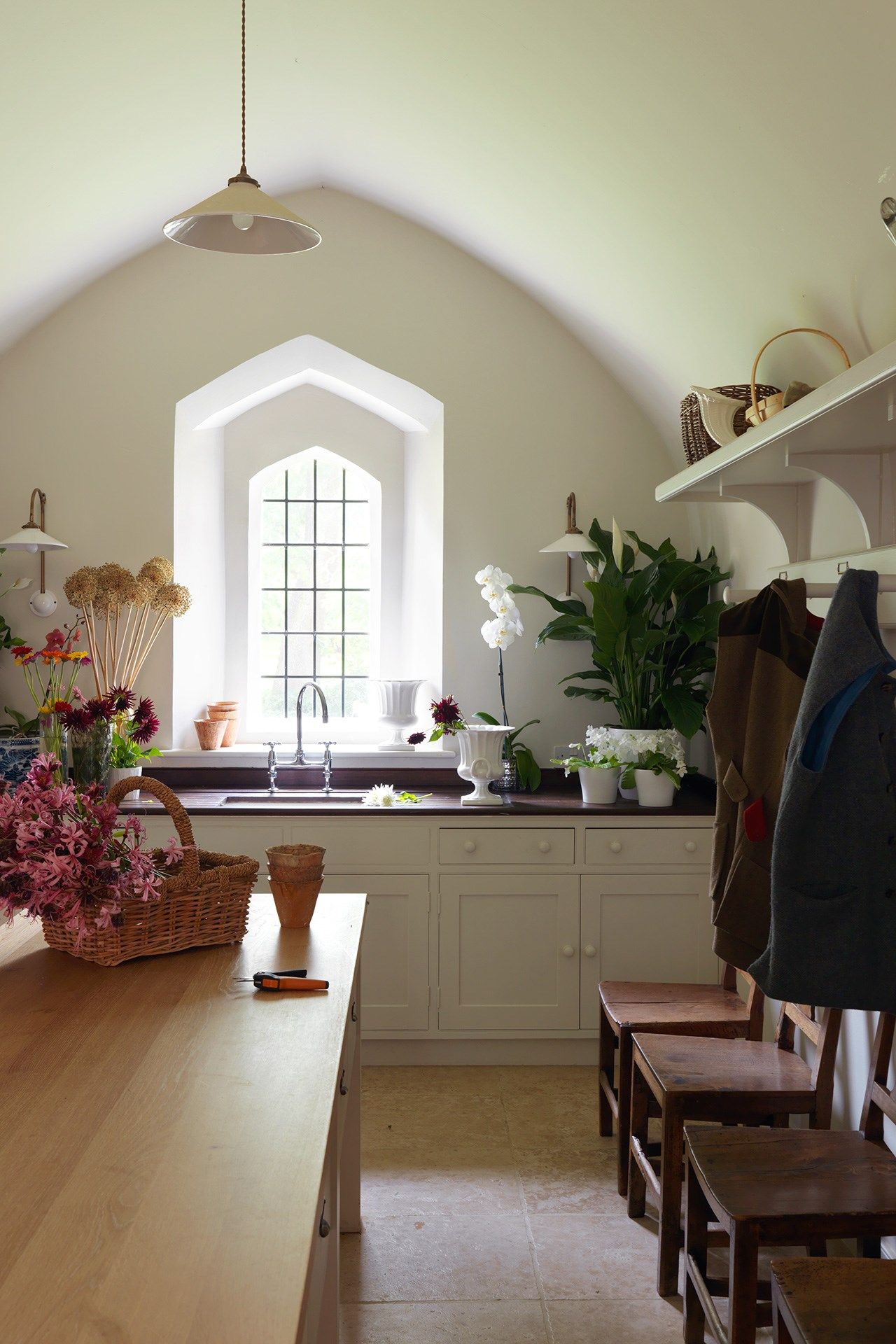 Image may contain Interior Design Indoors Room Plant Flooring Living Room Wood Flower and Blossom