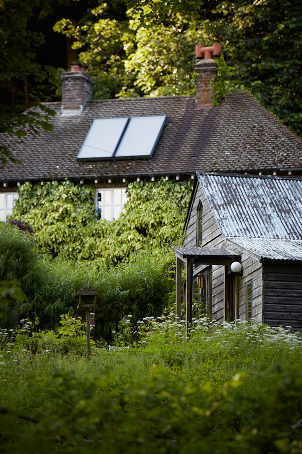 Image may contain Outdoors Nature Building Housing Countryside Roof Shelter Rural Hut and House