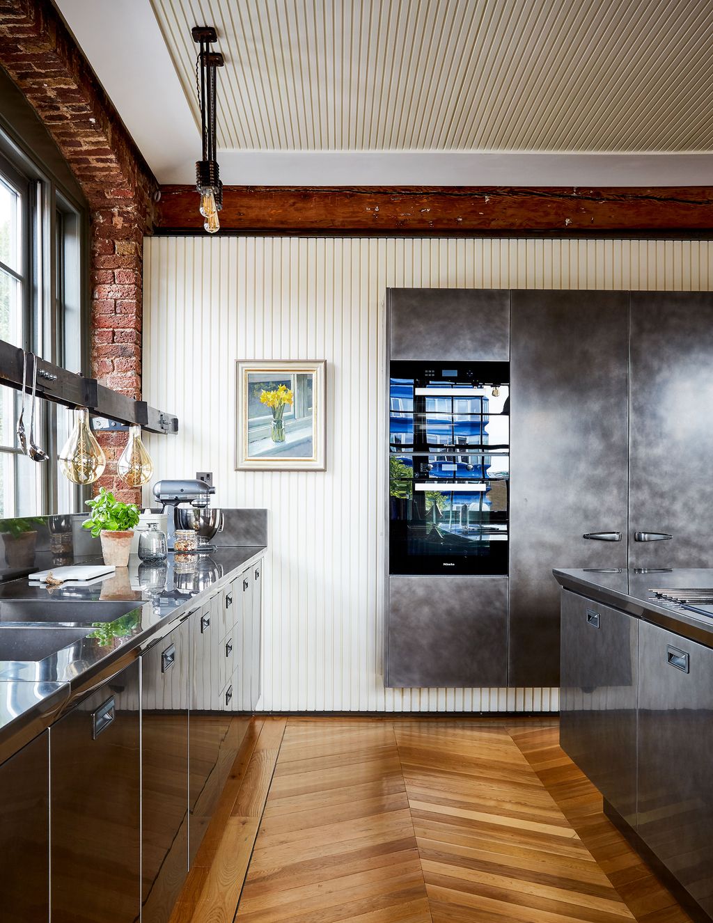 Matchstick timber panelling on the walls adds a textural element. The artwork is by Daisy SimsHilditch.