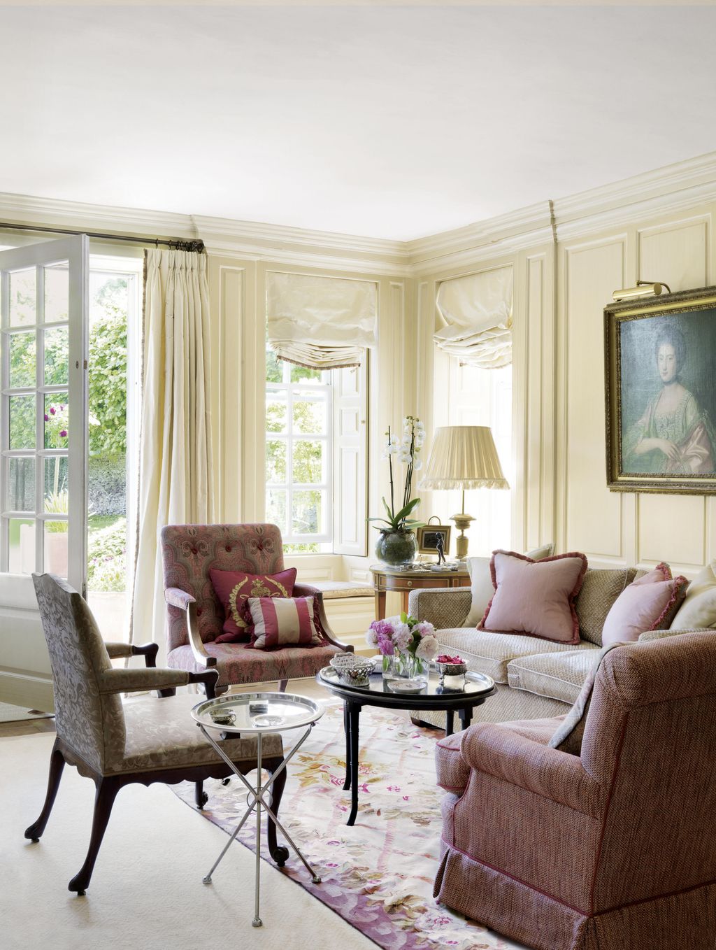 Image may contain Furniture Chair Living Room Indoors Room Table Couch Coffee Table Rug Human and Person